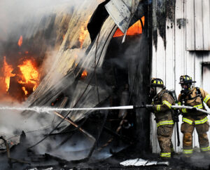 Car owners assess their four-wheeled fates after garage burns